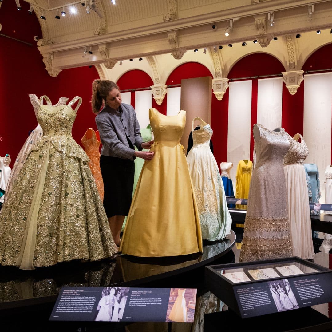 Exclusive: Royal Fashion Historian Explains How Queen Elizabeth “Turned Diplomacy Into An Art Form” And “Did It Her Way”